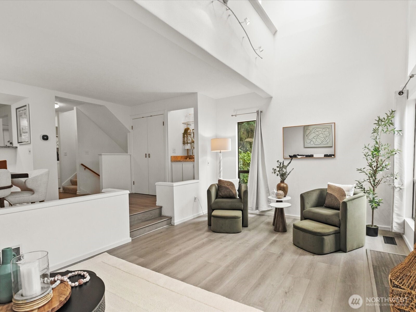 3506 108th Place Northeast, Unit 2 Bellevue, WA 98004 - Photo 10 of 39 a living room with furniture and a wooden floor