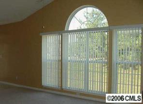 105 Kilborne Road Mooresville, NC 28117 - Photo 3 of 8 a view of an empty room with a window