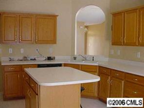105 Kilborne Road Mooresville, NC 28117 - Photo 4 of 8 a kitchen with a sink and cabinets