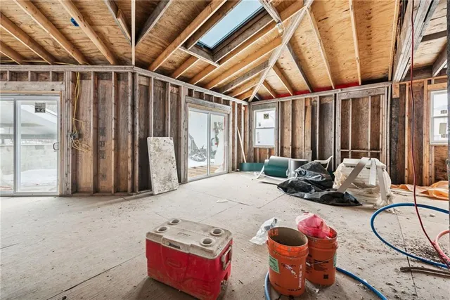 a bedroom with furniture and a ceiling fan