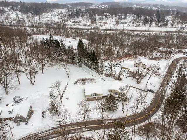 a view of a terrace with a snow and trees around