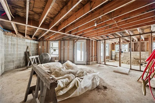 a bed room with a bed and a table