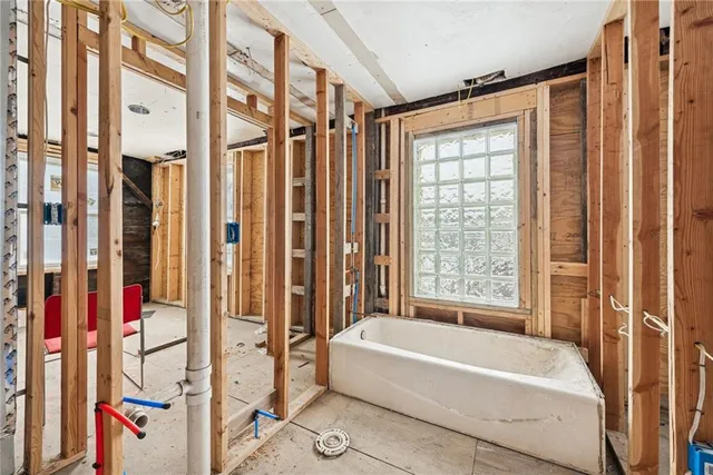a view of a balcony with wooden fence