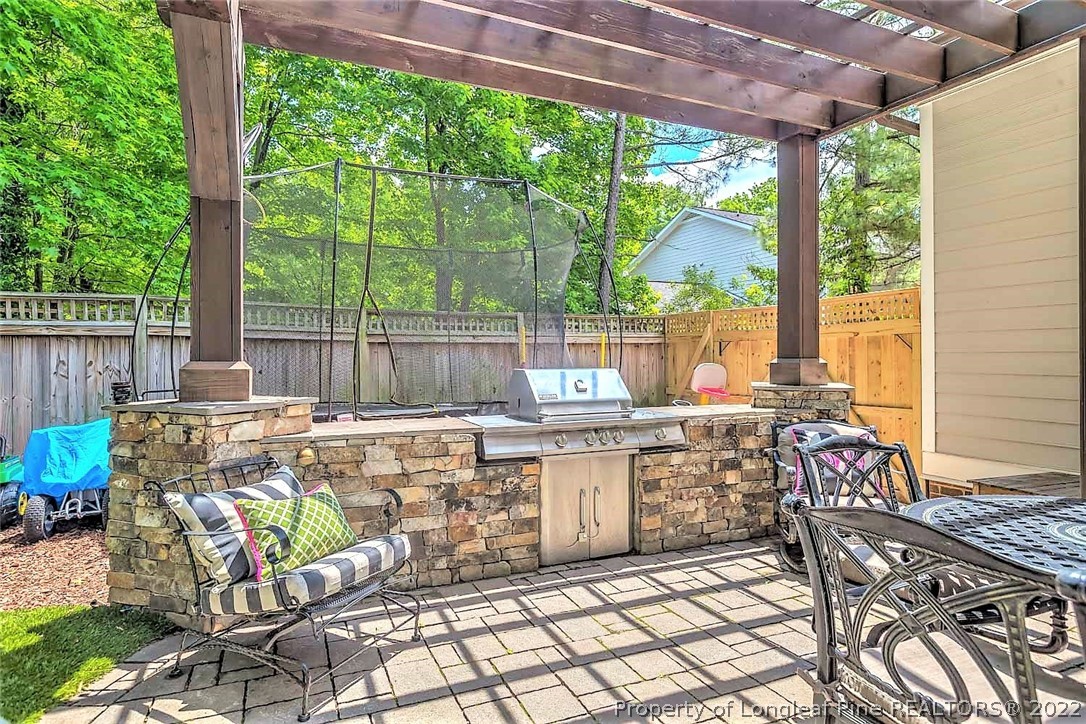 110 Lake Boone Trail Raleigh, NC 27608 - Photo 27 of 30 a view of an outdoor sitting area with furniture and garden view