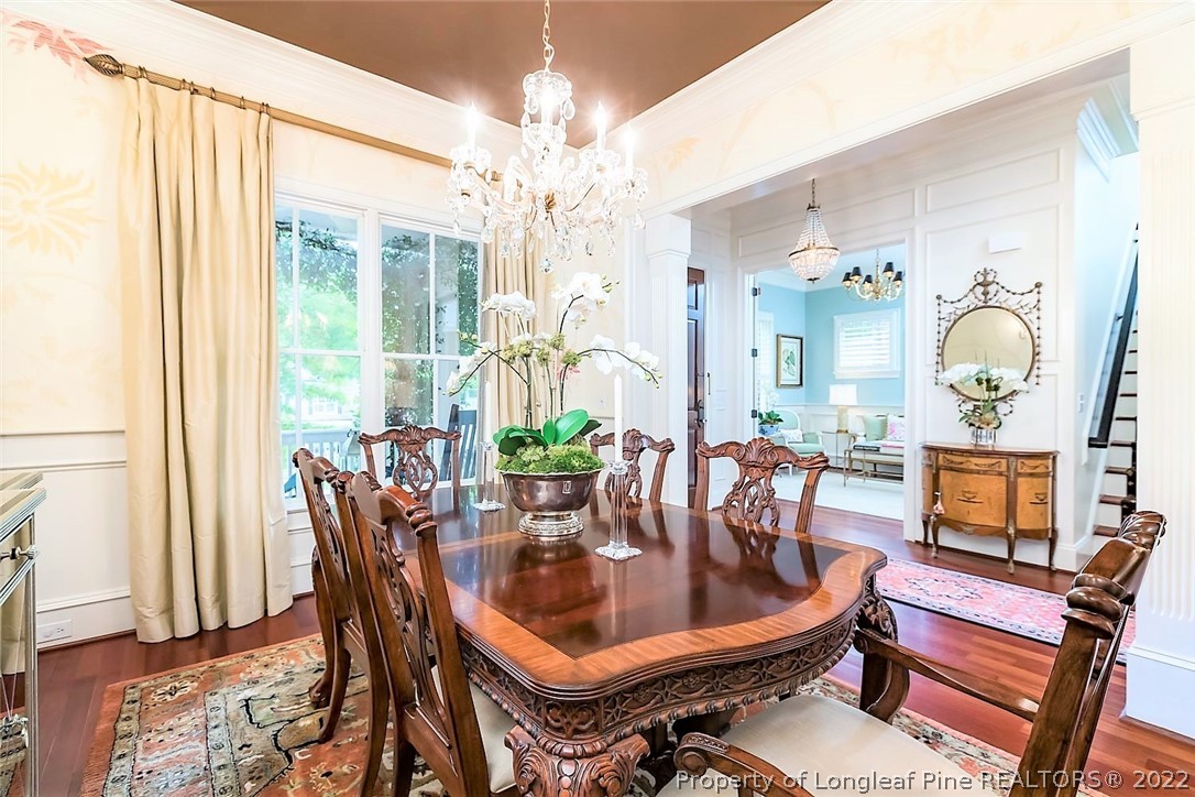 110 Lake Boone Trail Raleigh, NC 27608 - Photo 5 of 30 a dining room with furniture a livingroom and chandelier