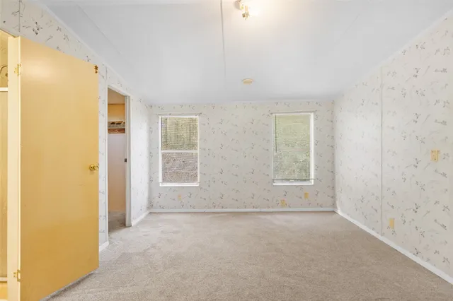 an empty room with windows