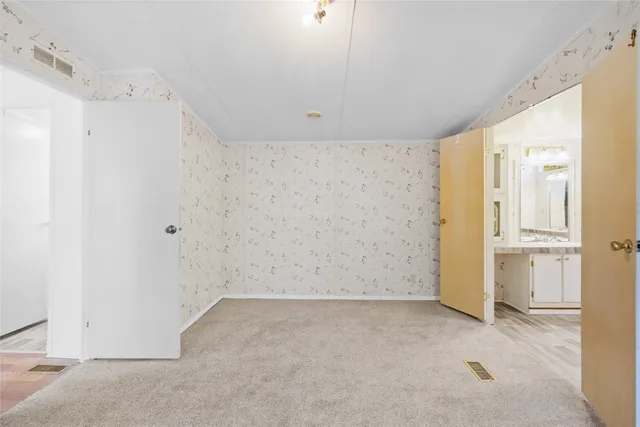 a bathroom with a tub a sink and a window