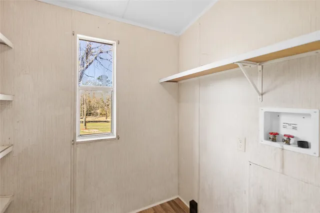 a view of a closet area with an empty room