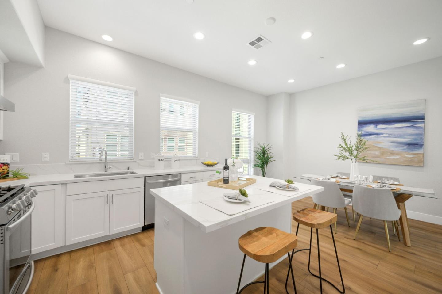 361 Montague Expressway Milpitas, CA 95035 - Photo 1 of 1 a kitchen with a dining table chairs and sink