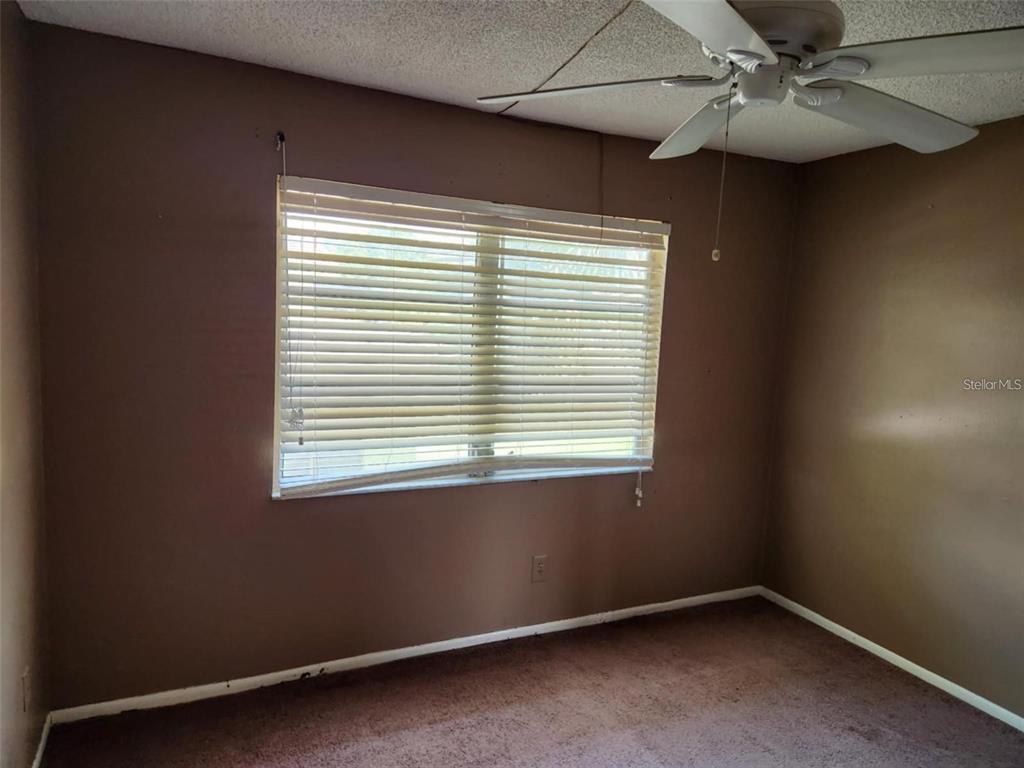 3773 Delta Street Sarasota, FL 34232 - Photo 14 of 15 an empty room with a window