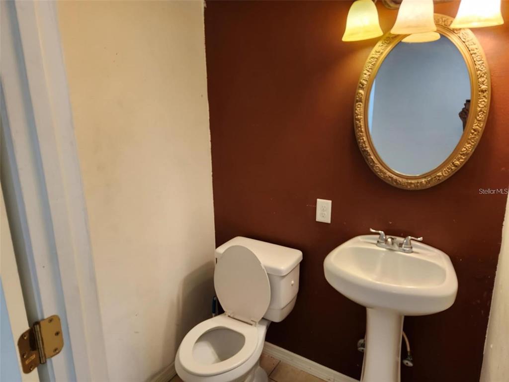 3773 Delta Street Sarasota, FL 34232 - Photo 8 of 15 a bathroom with a toilet and a sink