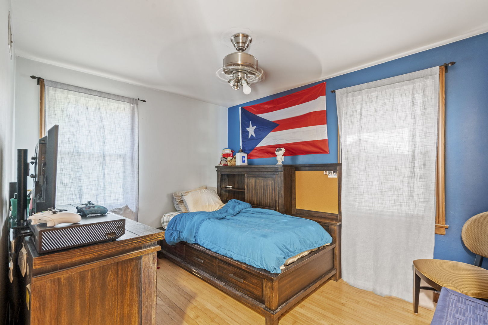 2419 Elm Street River Grove, IL 60171 - Photo 11 of 15 a bedroom with a bed a dresser and next to a window