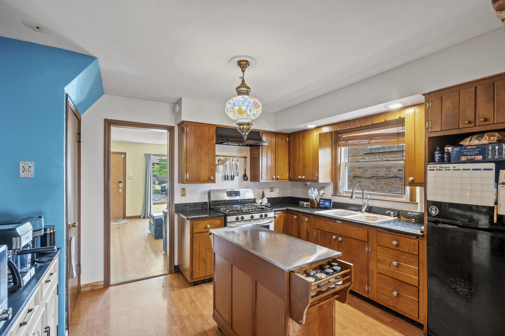 2419 Elm Street River Grove, IL 60171 - Photo 7 of 15 a kitchen with a sink stove and refrigerator