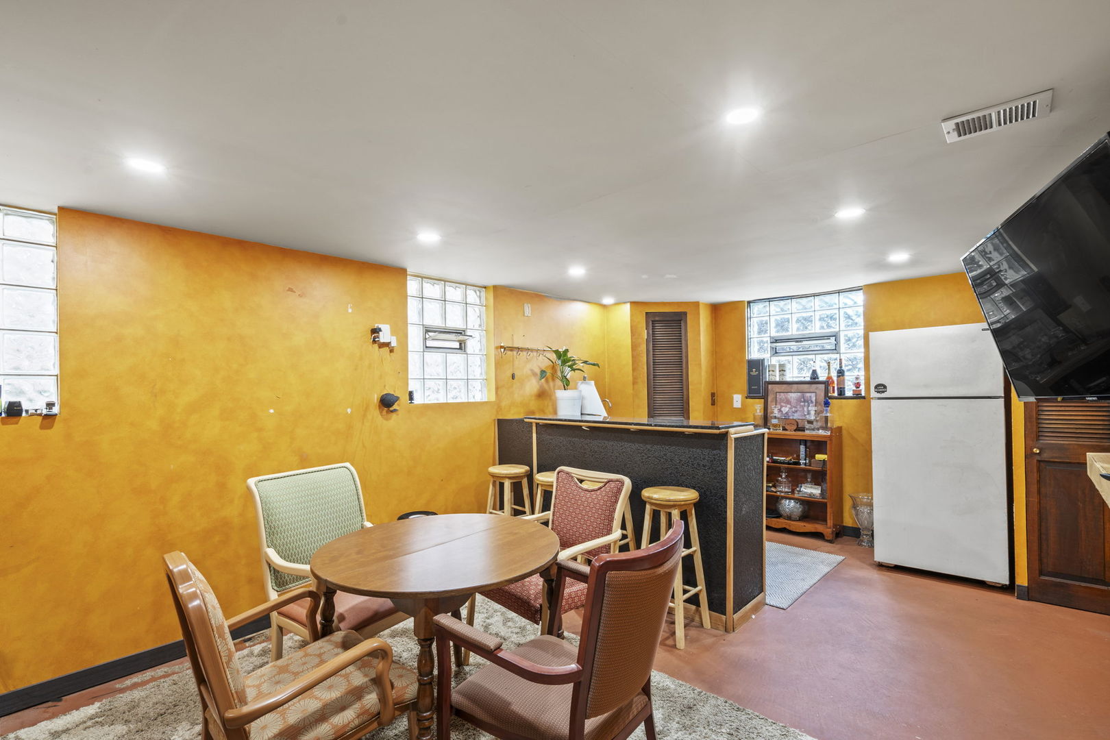 2419 Elm Street River Grove, IL 60171 - Photo 8 of 15 a view of a dining room with furniture a kitchen and chandelier