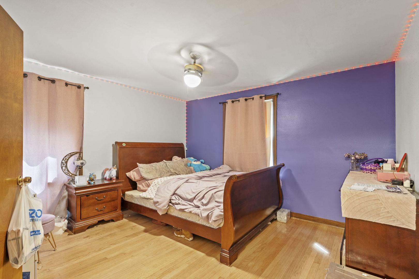 2419 Elm Street River Grove, IL 60171 - Photo 10 of 15 a bedroom with a bed and wooden floor