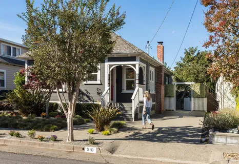 a front view of a house with street