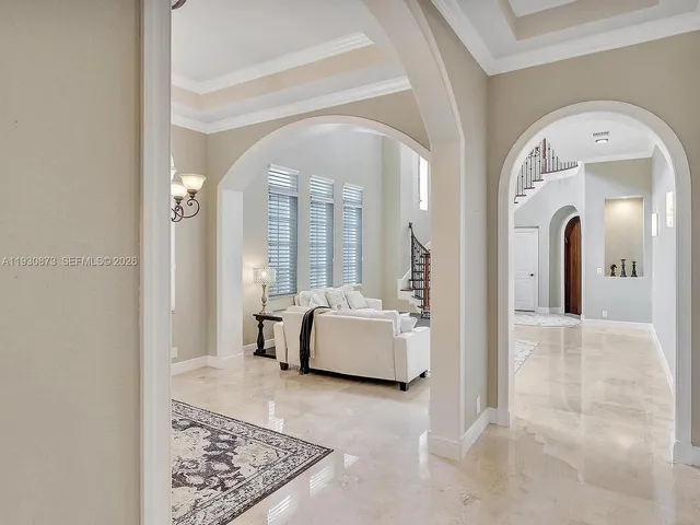 a kitchen with a sink a counter space and stainless steel appliances