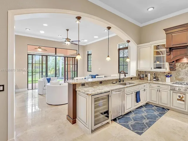 a kitchen with a sink stove and cabinets