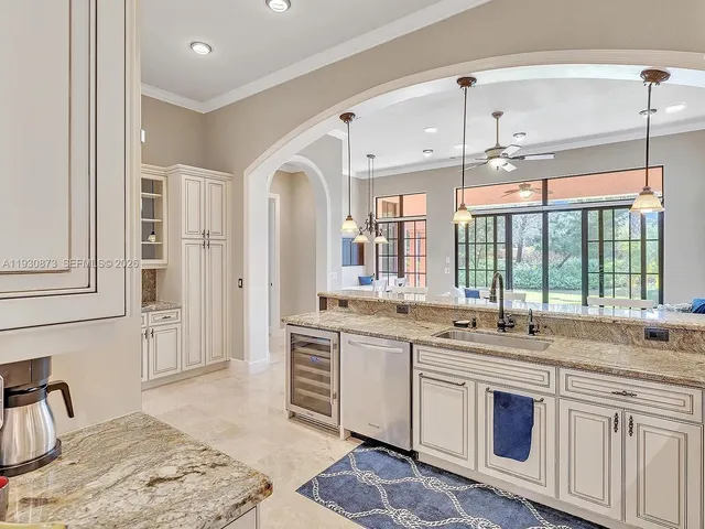 a utility room with sink dryer and washer