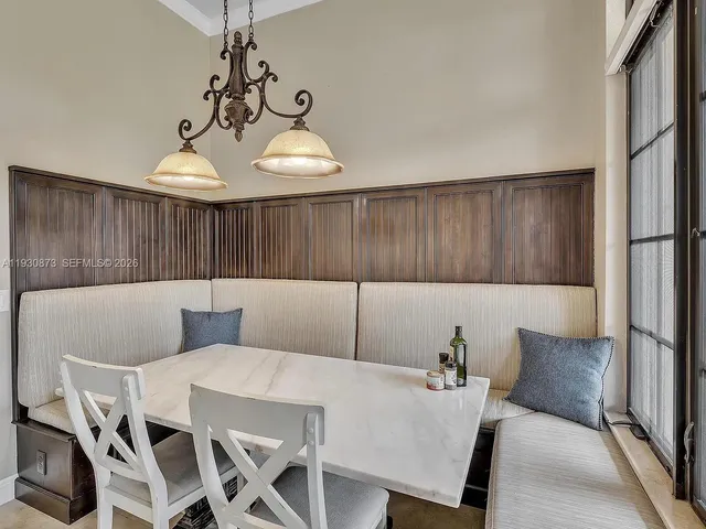a spacious en suite bathroom with a sink and a mirror