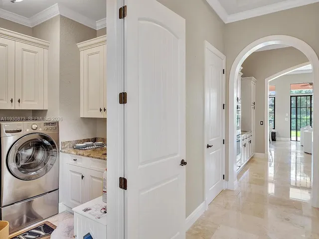 a spacious bathroom with a granite countertop sink a mirror and a shower