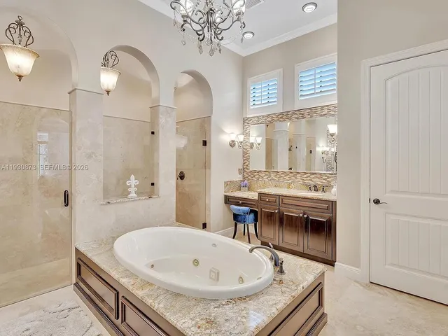 a bedroom with a bed and a ceiling fan