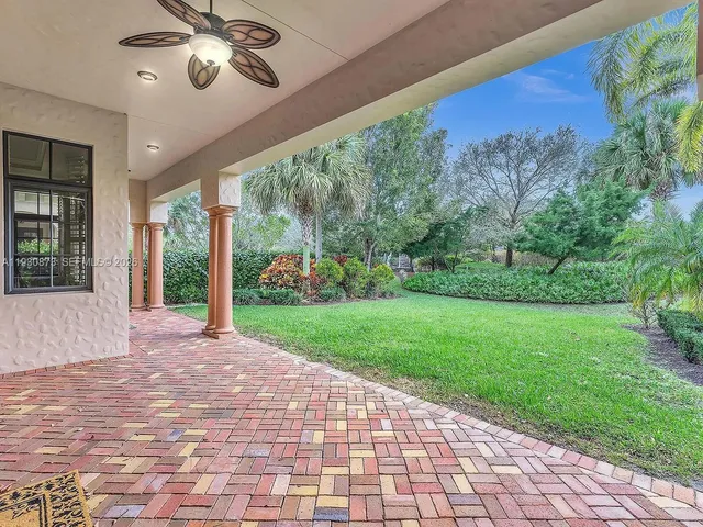 an aerial view of multiple houses with yard