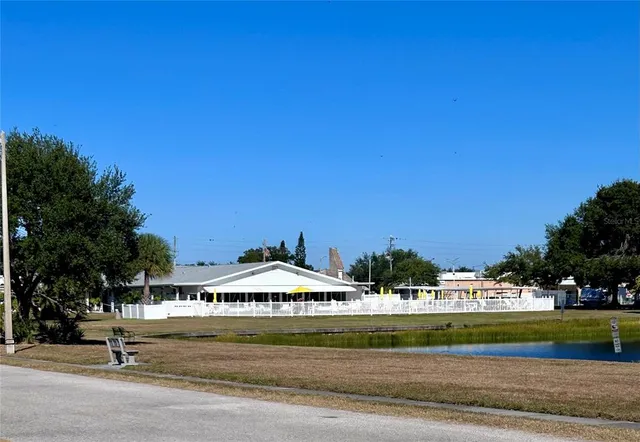 a living room filled with furniture and a window