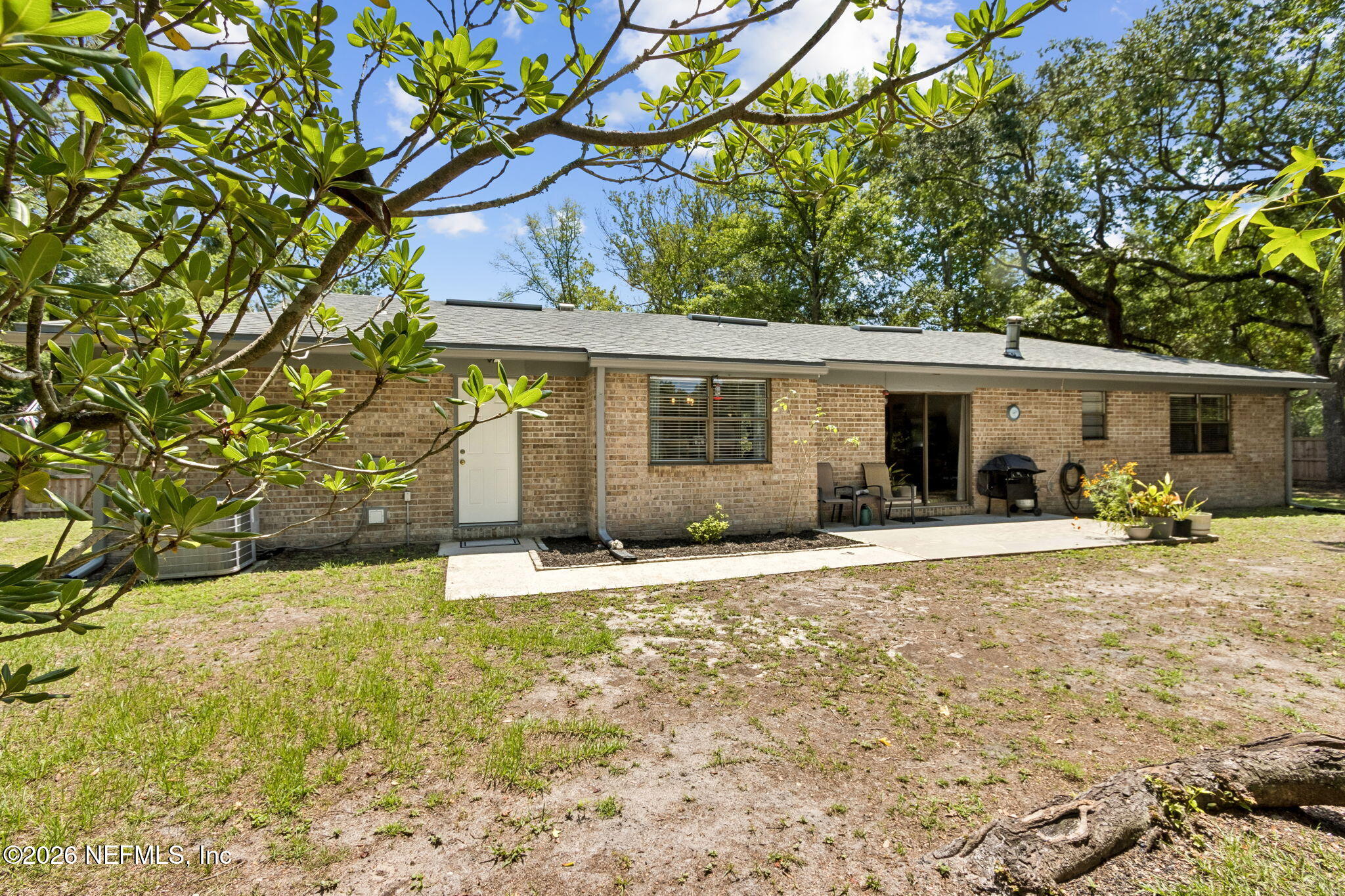 3194 Creighton Landing Road Fleming Island, FL 32003 - Photo 13 of 31 a front view of a house with a yard and garage