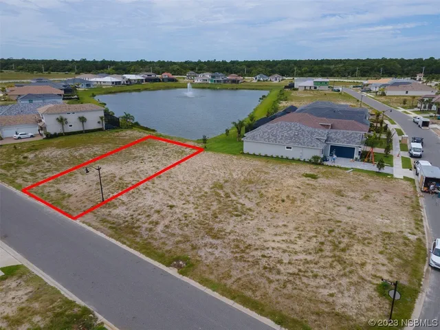 swimming pool view with a lake view