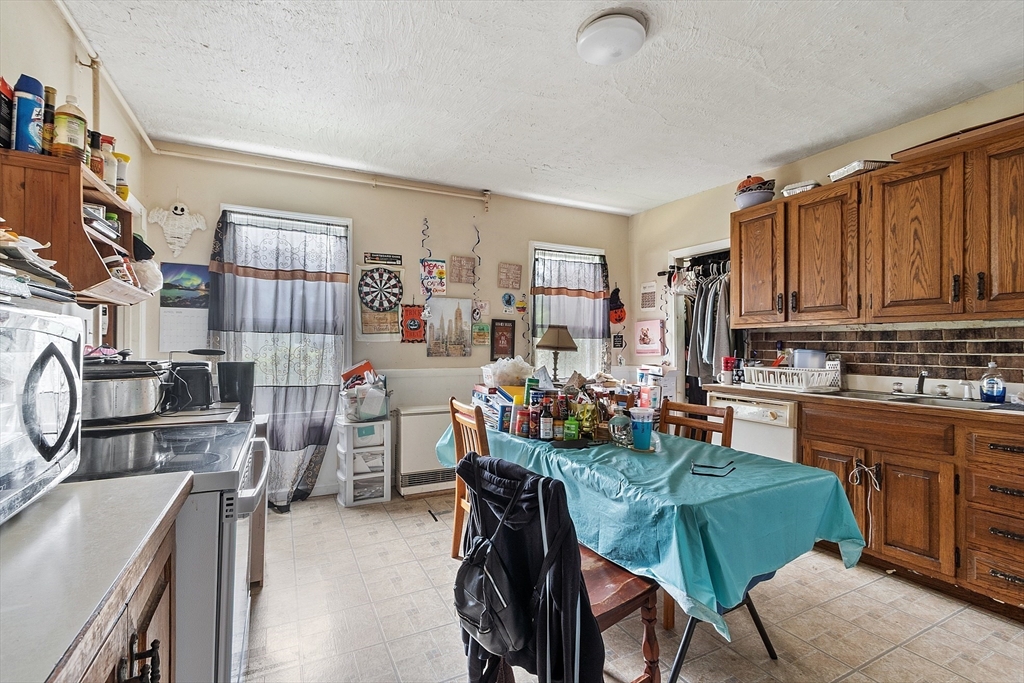 132 Hazel Street Fitchburg, MA 01420 - Photo 12 of 26 a view of a kitchen and dining room
