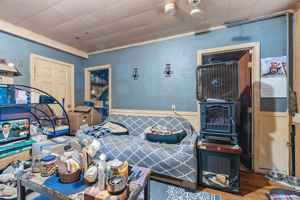 132 Hazel Street Fitchburg, MA 01420 - Photo 17 of 26 a bedroom with furniture and a wooden floor