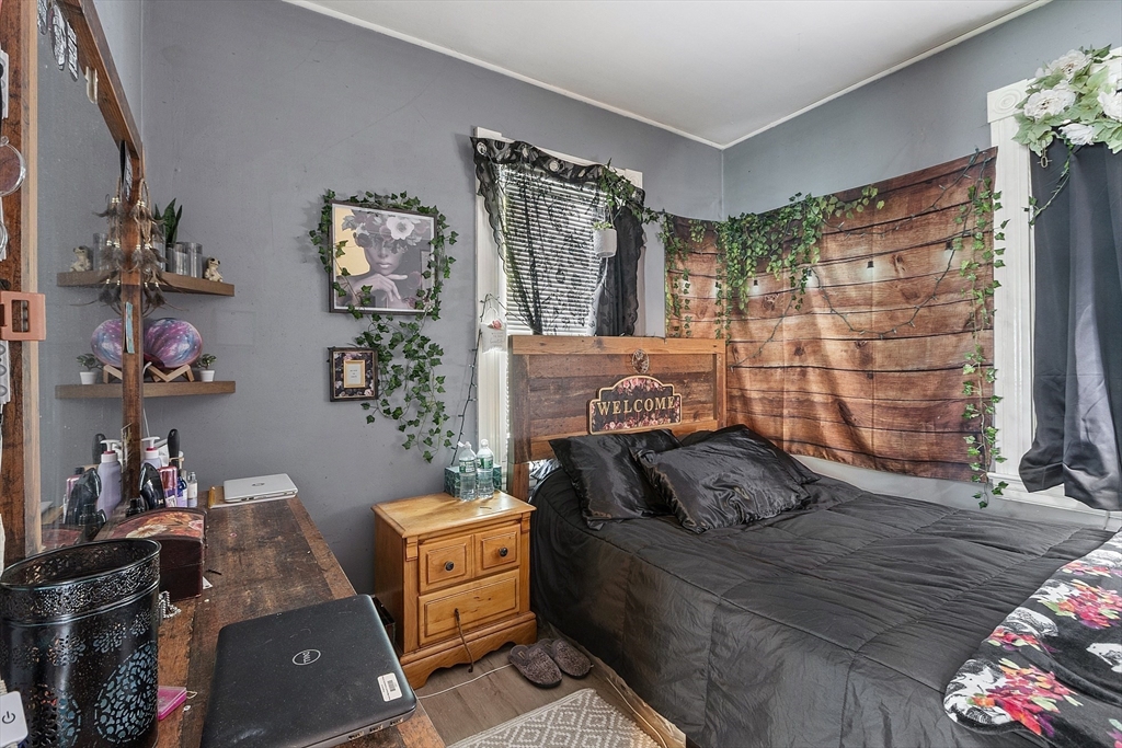132 Hazel Street Fitchburg, MA 01420 - Photo 6 of 26 a living room with furniture and a fireplace