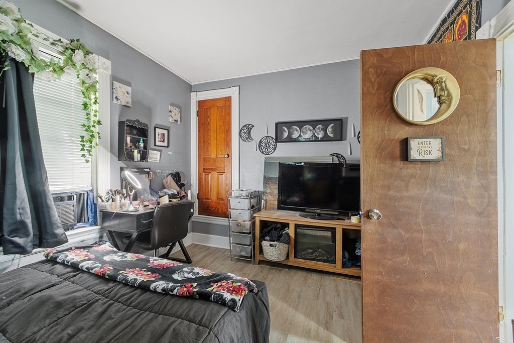 132 Hazel Street Fitchburg, MA 01420 - Photo 7 of 26 a living room with furniture and a flat screen tv
