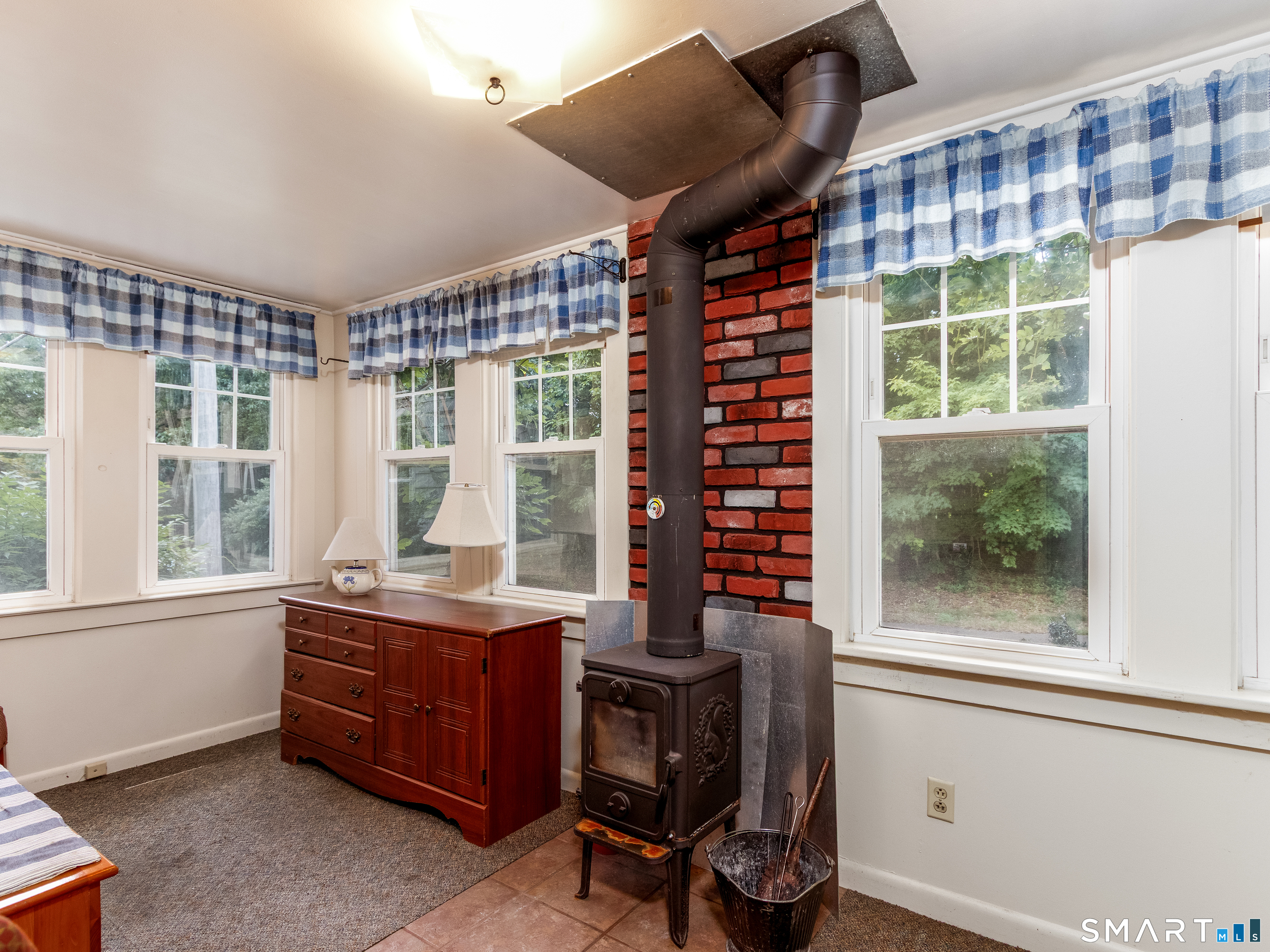 208 Twin Lakes Road North Branford, CT 06471 - Photo 14 of 39 Front Enclosed Porch with Wood Stove