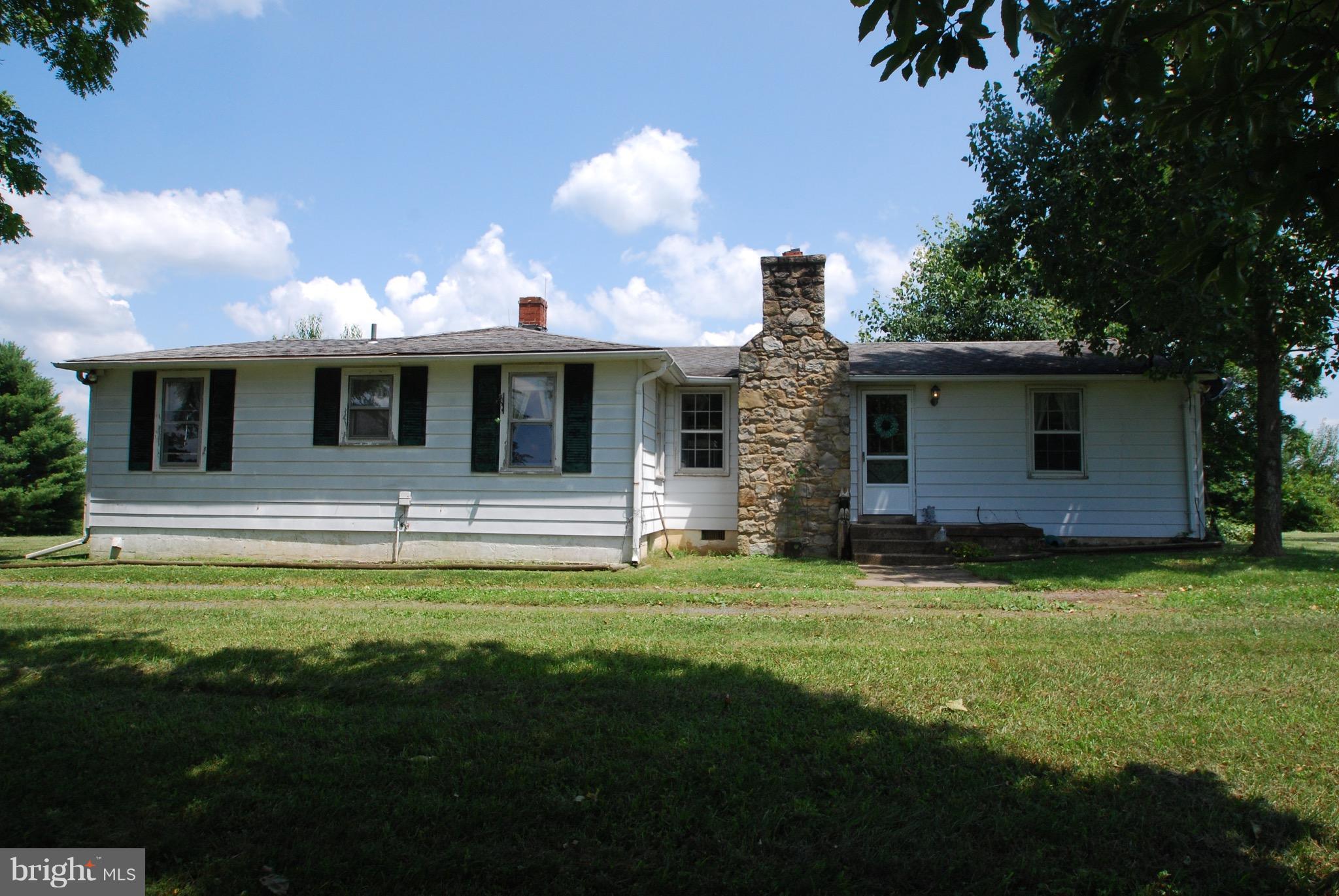 10775 Cliff Mills Road Marshall, VA 20115 - Photo 1 of 17 a view of a house with backyard and porch