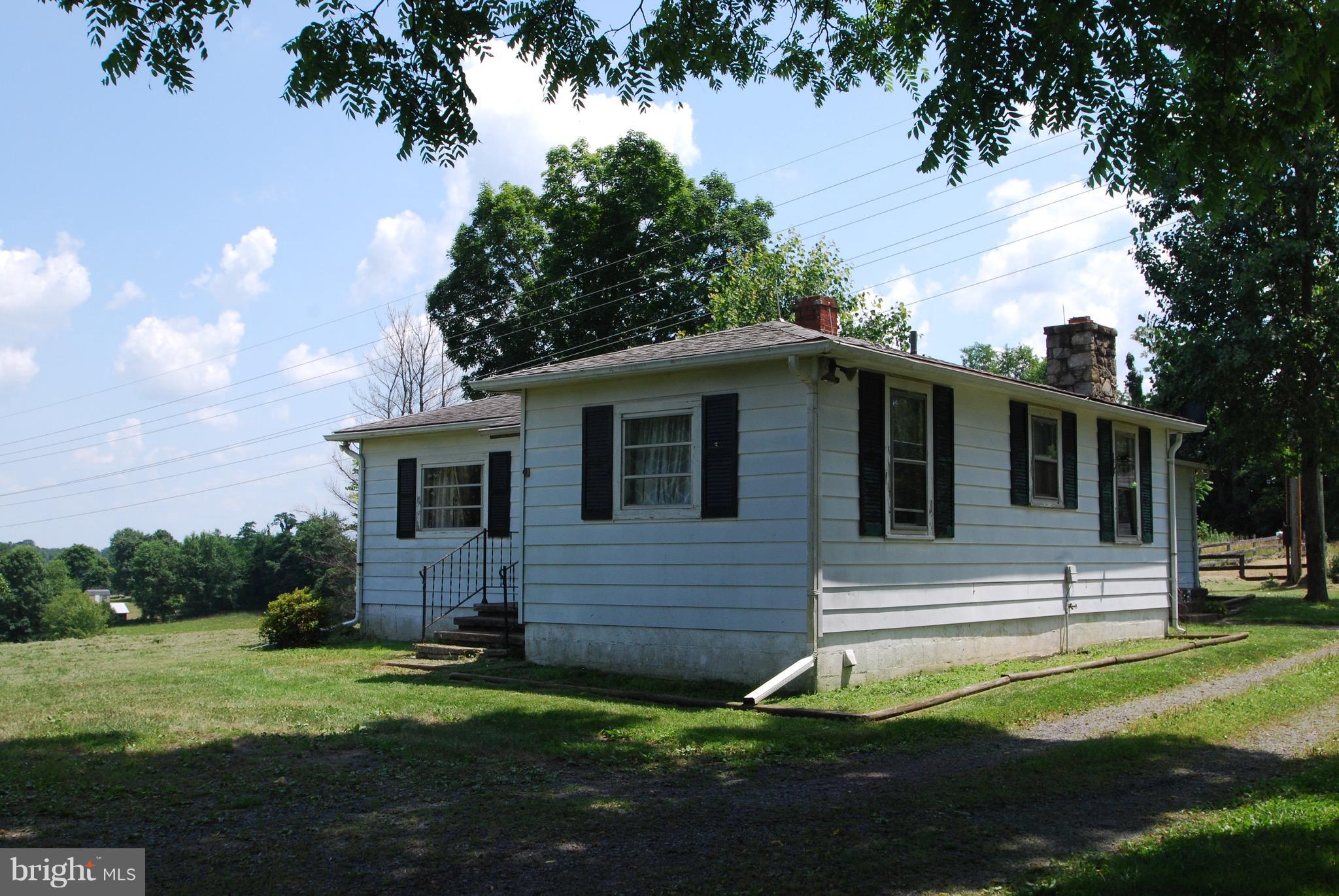 10775 Cliff Mills Road Marshall, VA 20115 - Photo 12 of 17 a view of a house with a backyard