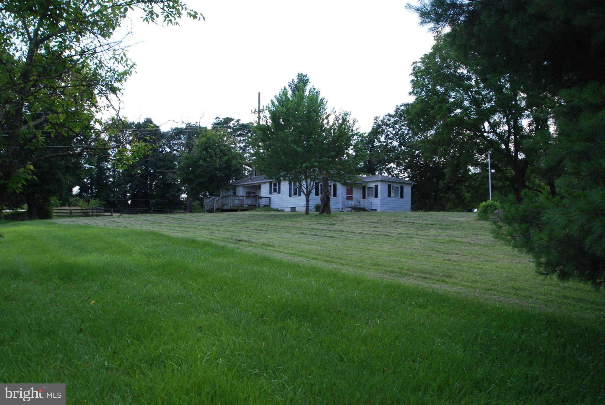 10775 Cliff Mills Road Marshall, VA 20115 - Photo 17 of 17 a view of green field with trees in the background