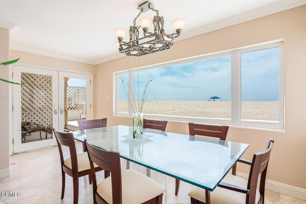 4165 Ocean Drive Oxnard, CA 93035 - Photo 16 of 44 a dining room with furniture a chandelier and window