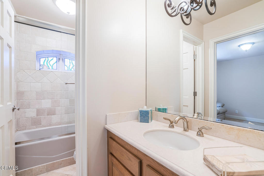 4165 Ocean Drive Oxnard, CA 93035 - Photo 18 of 44 a bathroom with a sink and a mirror
