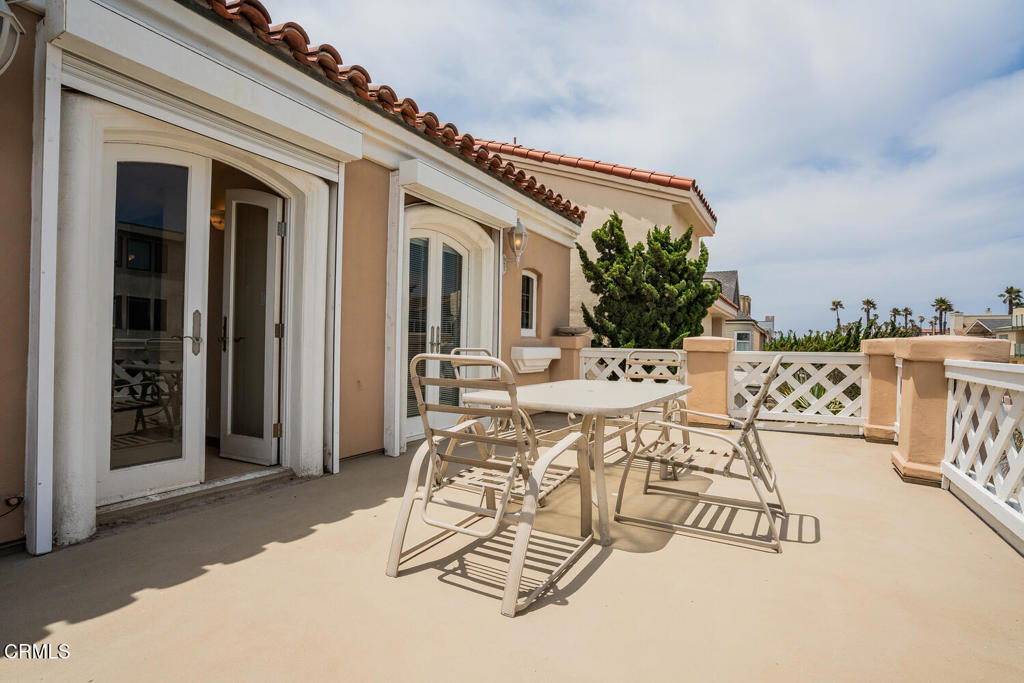 4165 Ocean Drive Oxnard, CA 93035 - Photo 39 of 44 a view of a patio with table and chairs