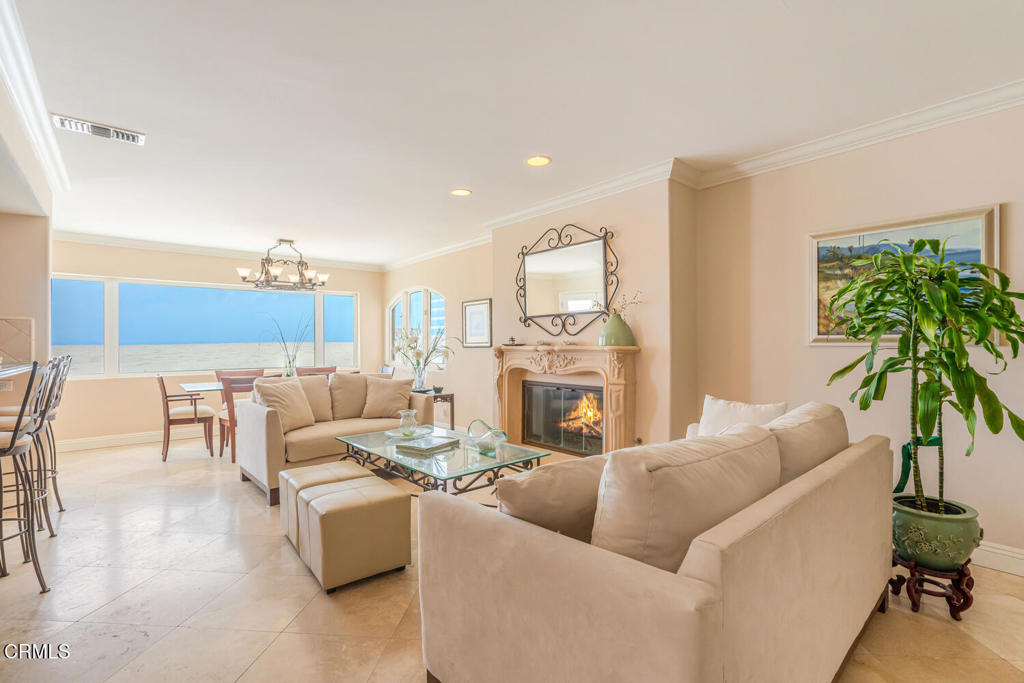 4165 Ocean Drive Oxnard, CA 93035 - Photo 8 of 44 a living room with furniture potted plant and a fireplace