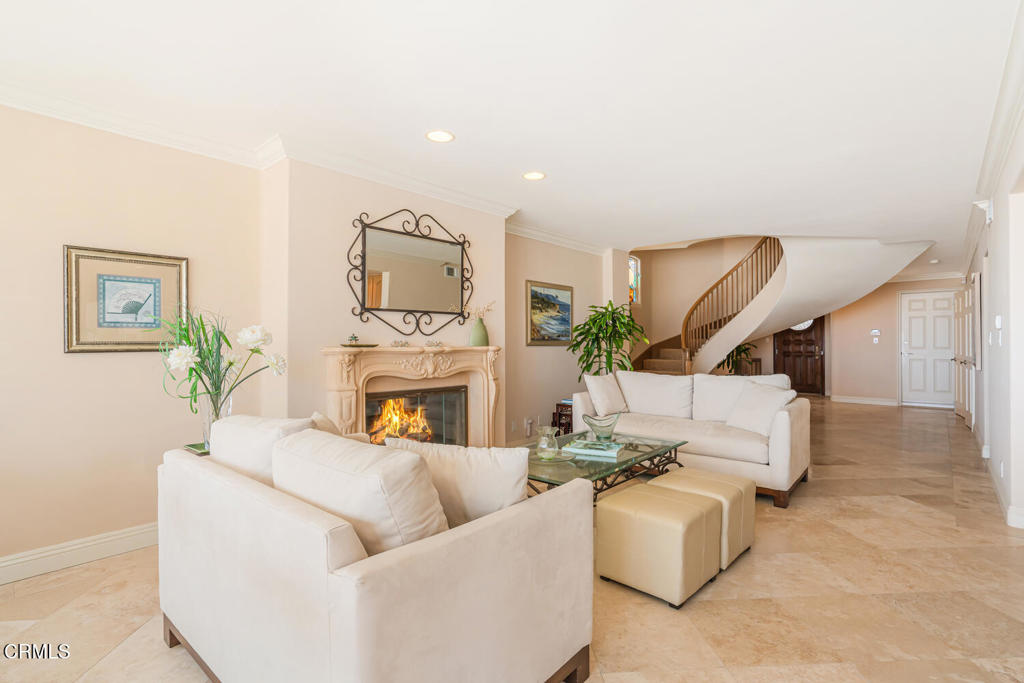 4165 Ocean Drive Oxnard, CA 93035 - Photo 9 of 44 a living room with furniture and a fireplace