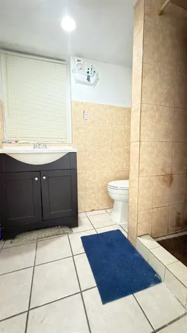 a bathroom with a bathtub and shower