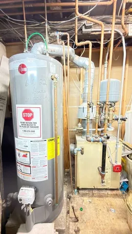 a utility room with a refrigerator and washer