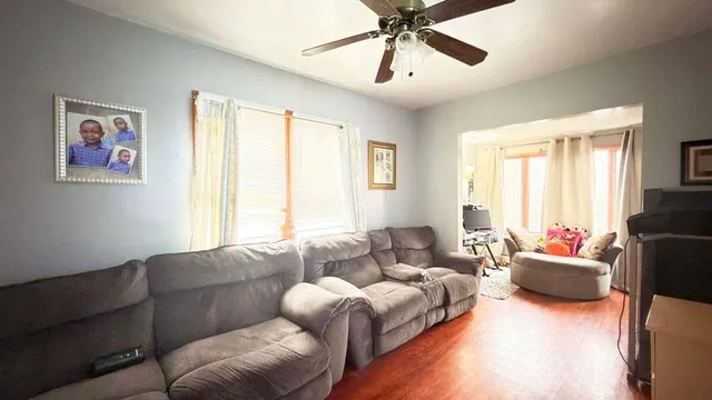 a living room with furniture or couch and a window