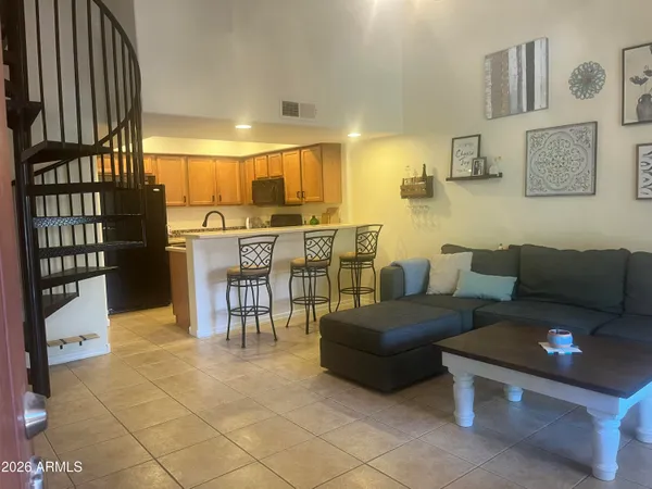 a living room with furniture and a gate