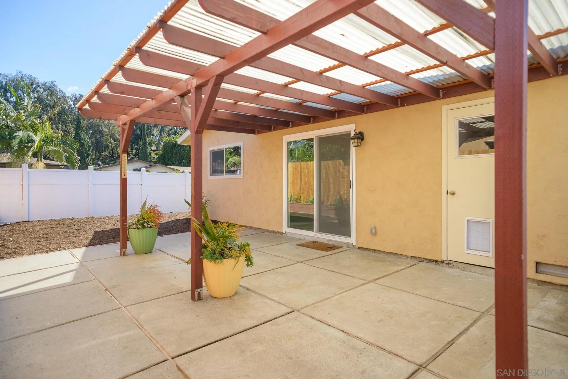 102 Magdalena Drive Oceanside, CA 92057 - Photo 14 of 48 a view of a porch with dining table and chairs