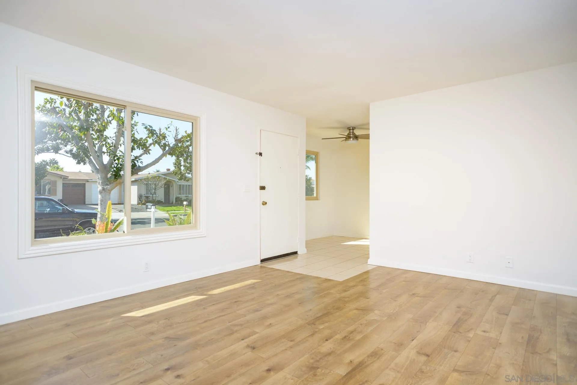 102 Magdalena Drive Oceanside, CA 92057 - Photo 16 of 48 a view of empty room with wooden floor and fan