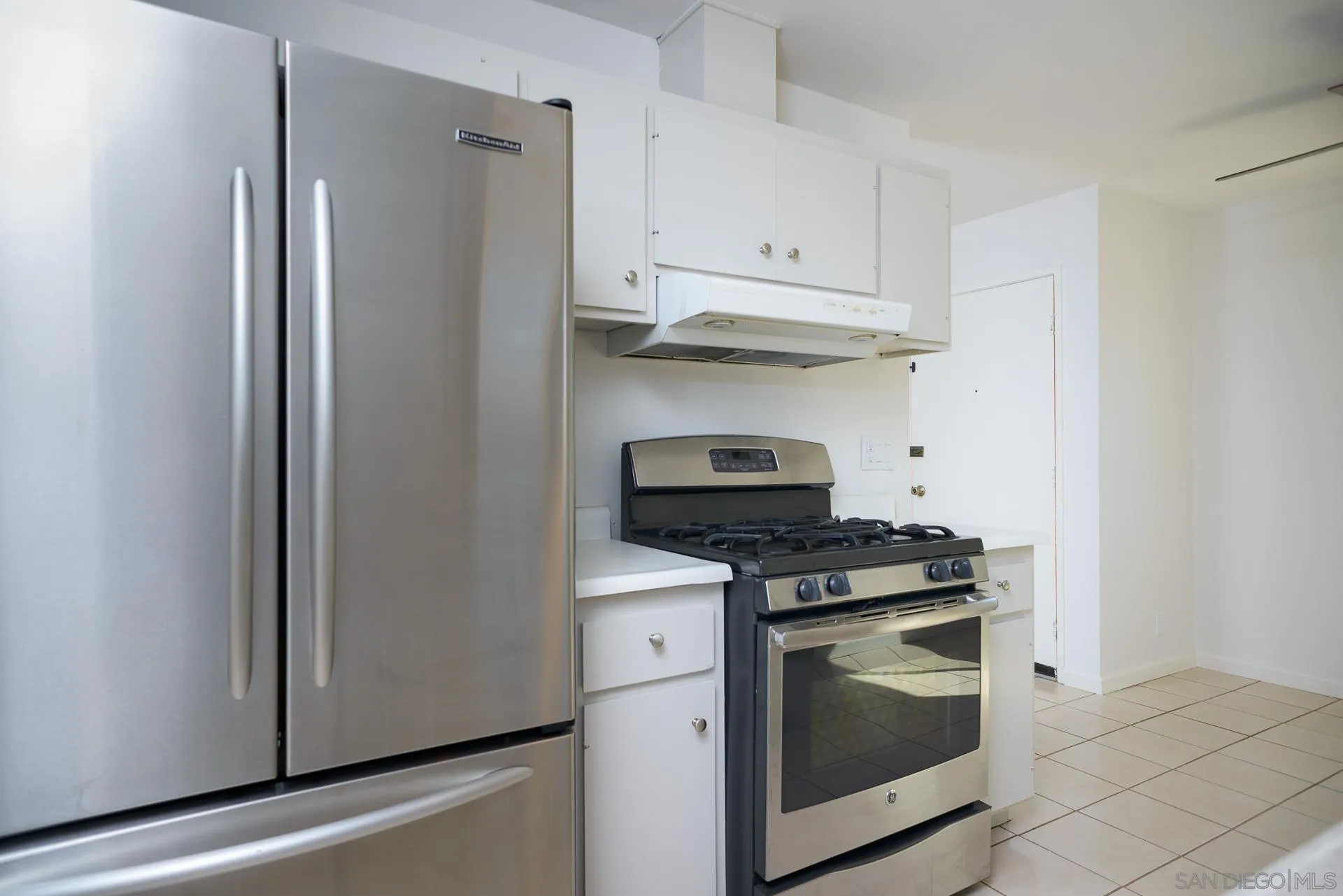 102 Magdalena Drive Oceanside, CA 92057 - Photo 21 of 48 a kitchen with stainless steel appliances granite countertop white cabinets and a stove